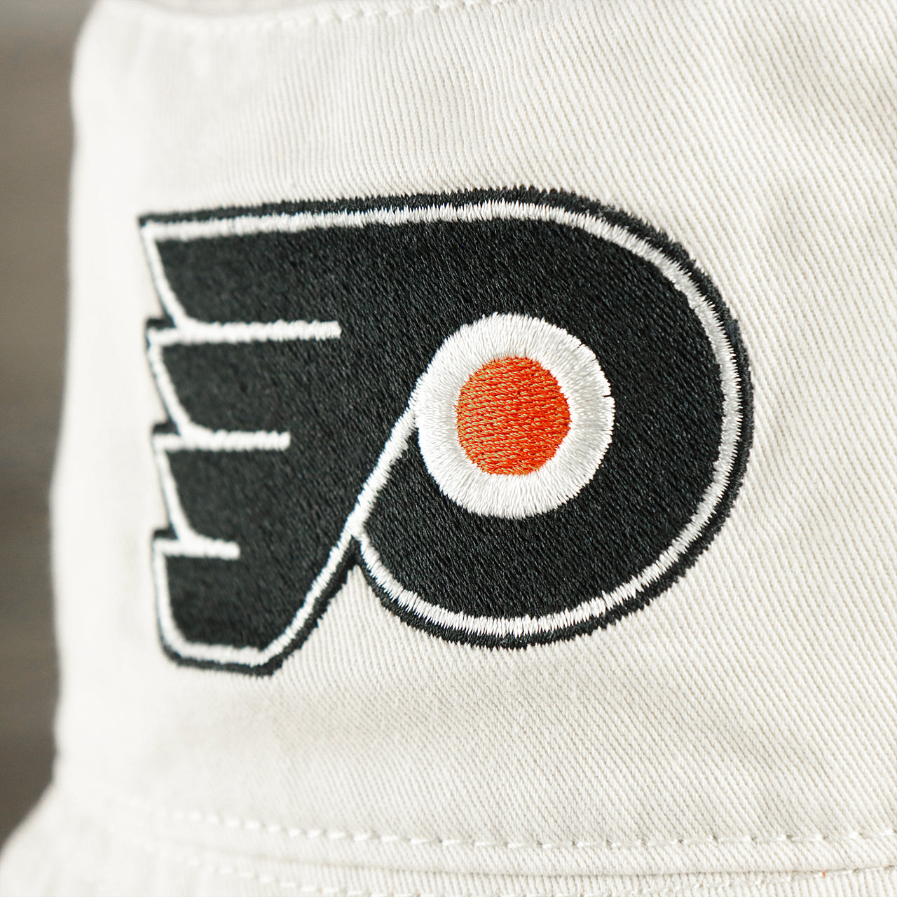 The Flyers Logo on the Philadelphia Flyers Logo Orange Undervisor Bucket Hat | Natural Bucket Hat