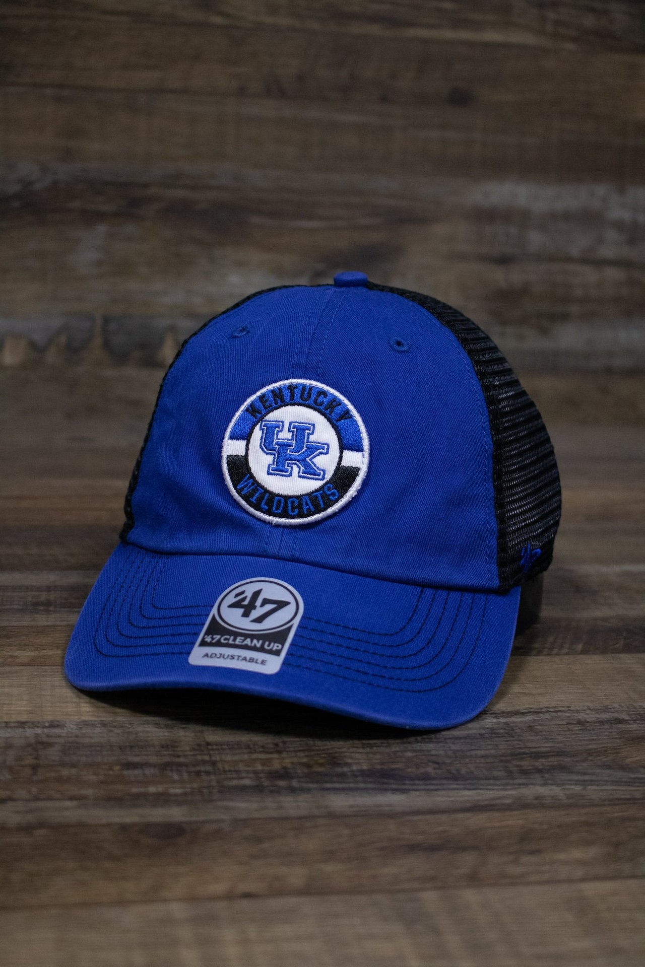 On the front of the Kentucky Wildcats Mesh Back dad hat is a circular patch with the University of Kentucky logo and the words Kentucky Wildcats