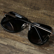 The Round Frames Black Lens Sunglasses with Black Gold Frame folded up