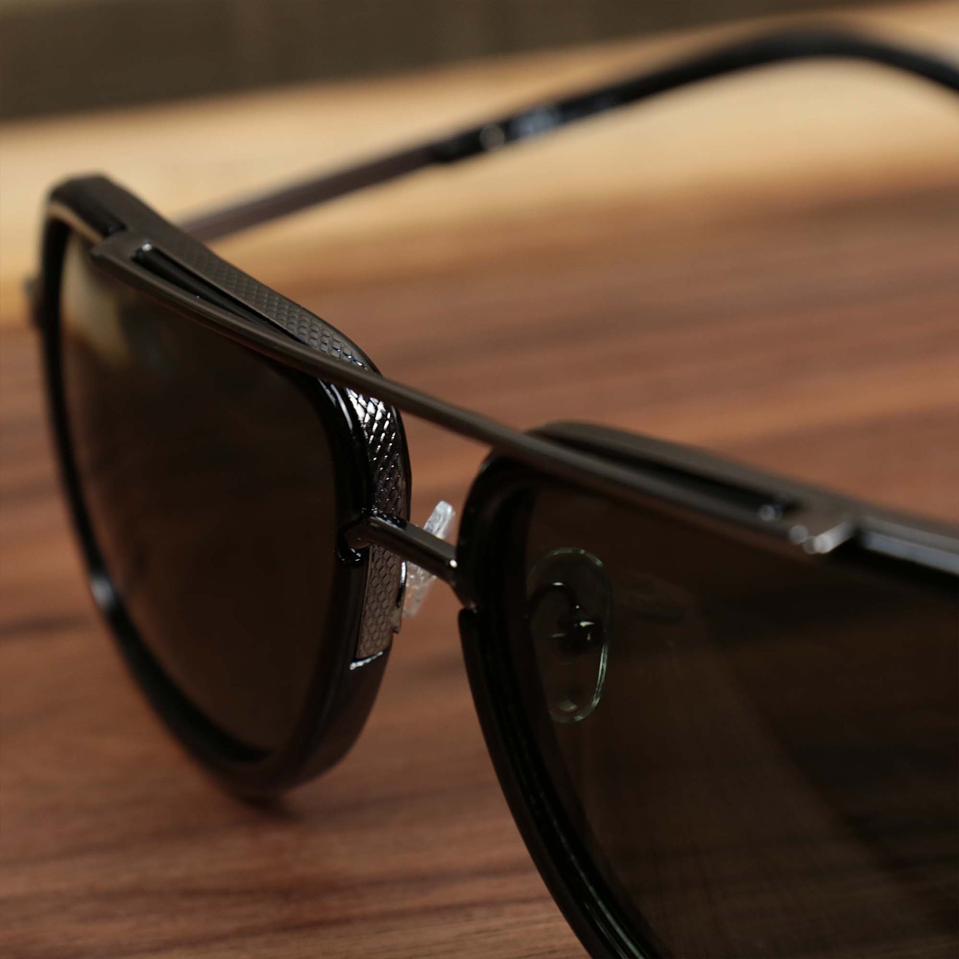 The bridge on the Round Frames Black Lens Sunglasses with Black Silver Frame