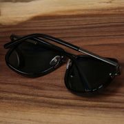 The Round Frames Black Lens Sunglasses with Black Silver Frame folded up