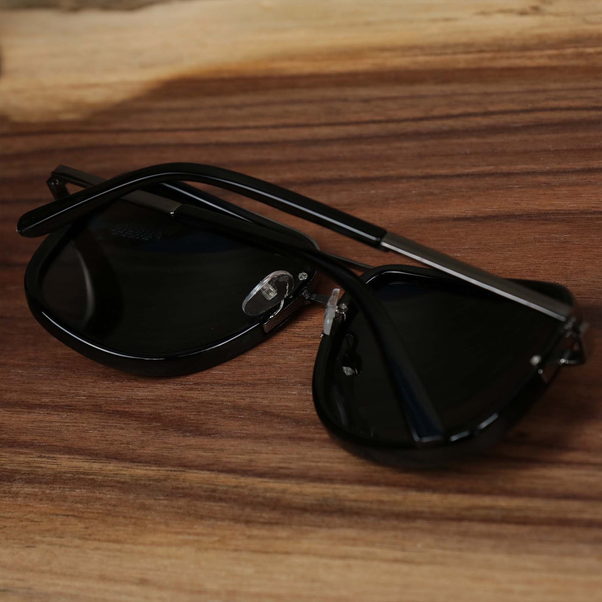 The Round Frames Black Lens Sunglasses with Black Silver Frame folded up