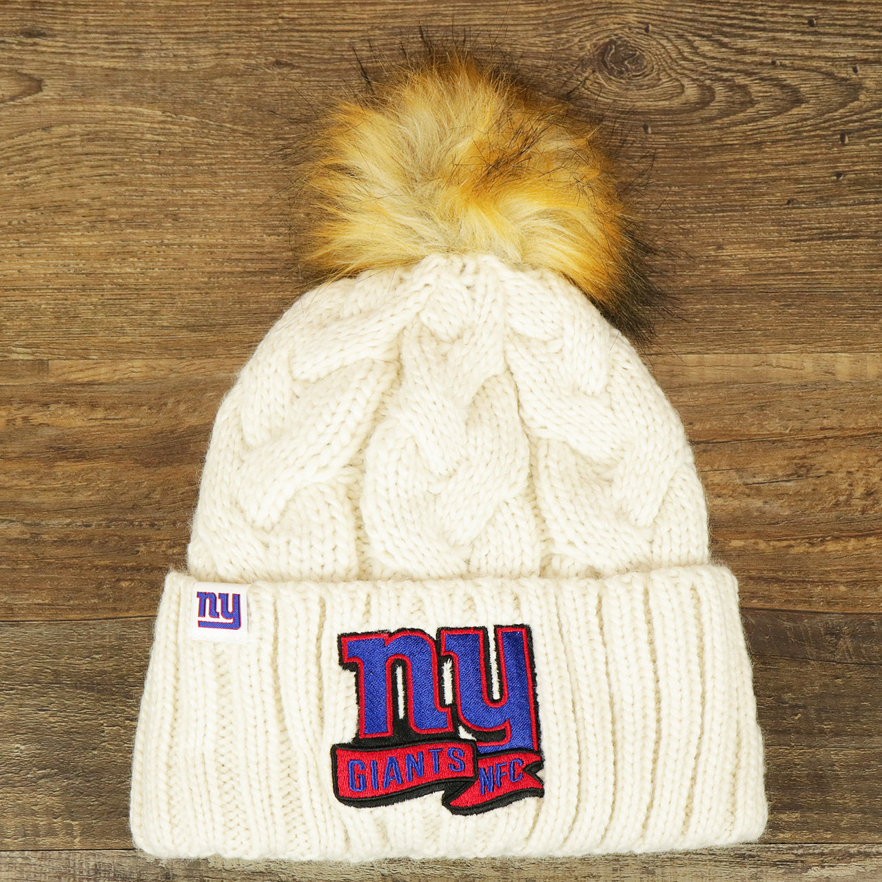 The Women’s New York Giants 2022 NFC Cuffed Winter Knit Meeko Pom Pom Beanie | Women’s White Winter Beanies