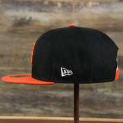 The wearer's left of the San Francisco Giants MLB Side Font Green Bottom 9Fifty Snapback Cap | Black Snap Cap