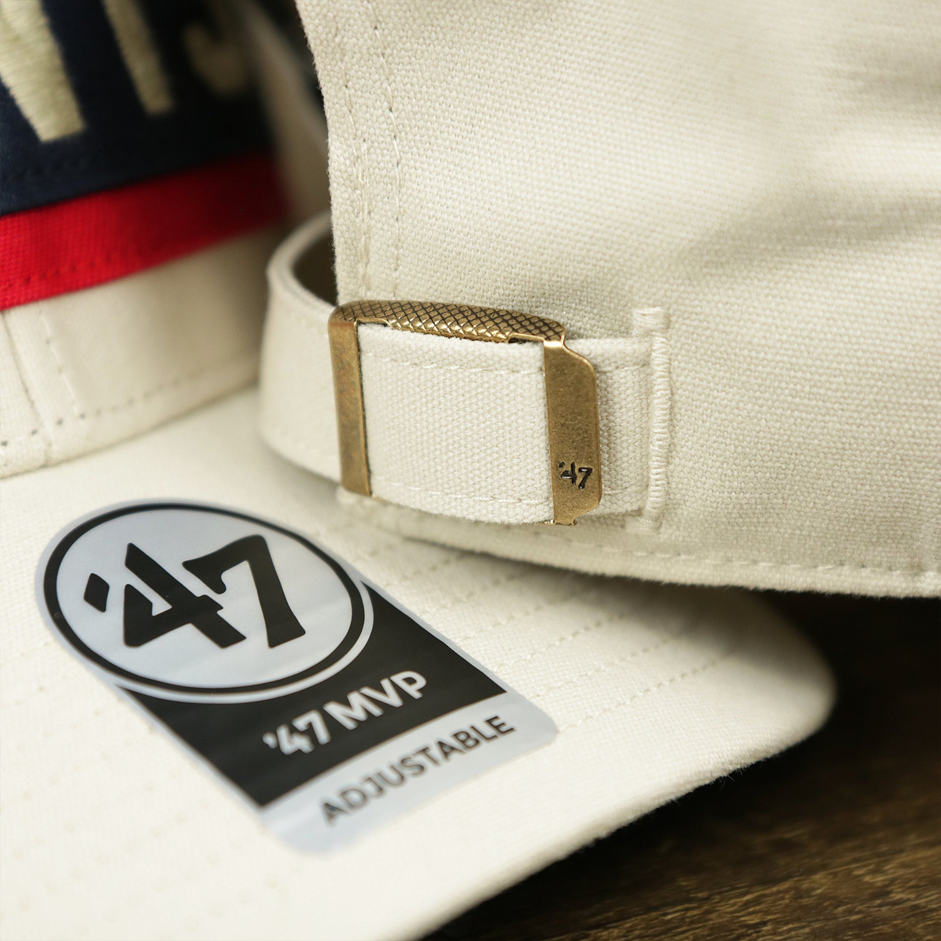 The 47 Brand Sticker on the Throwback New York Giants Striped Wordmark Legacy Giants Side Patch Crossroad Dad Hat | Bone Dad Hat