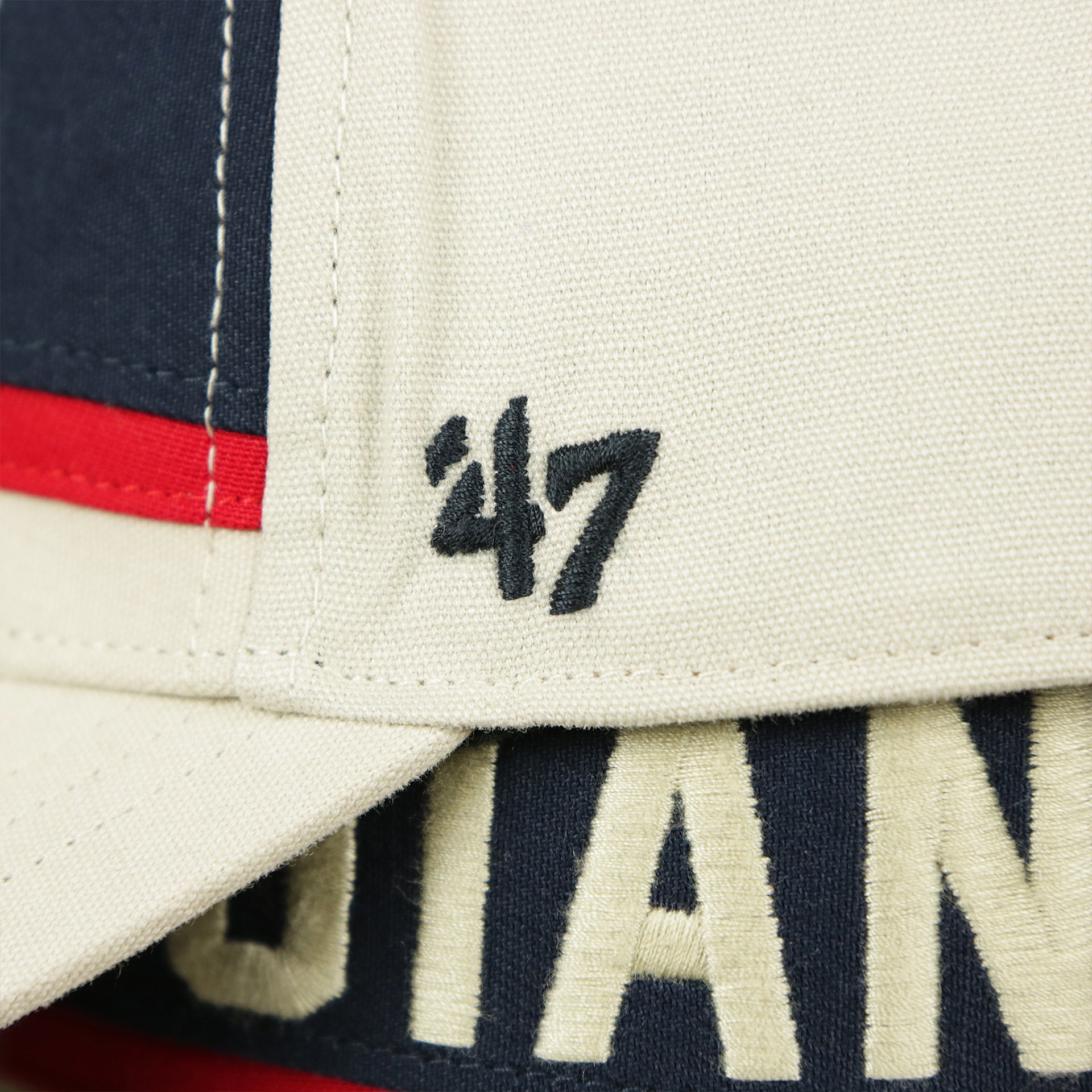 The 47 Brand Logo on the Throwback New York Giants Striped Wordmark Legacy Giants Side Patch Crossroad Dad Hat | Bone Dad Hat