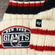 The 47 Brand Tag on the Throwback New York Giants Legacy Giants Helmet Patch Pom Pom Beanie | Natural Beanie