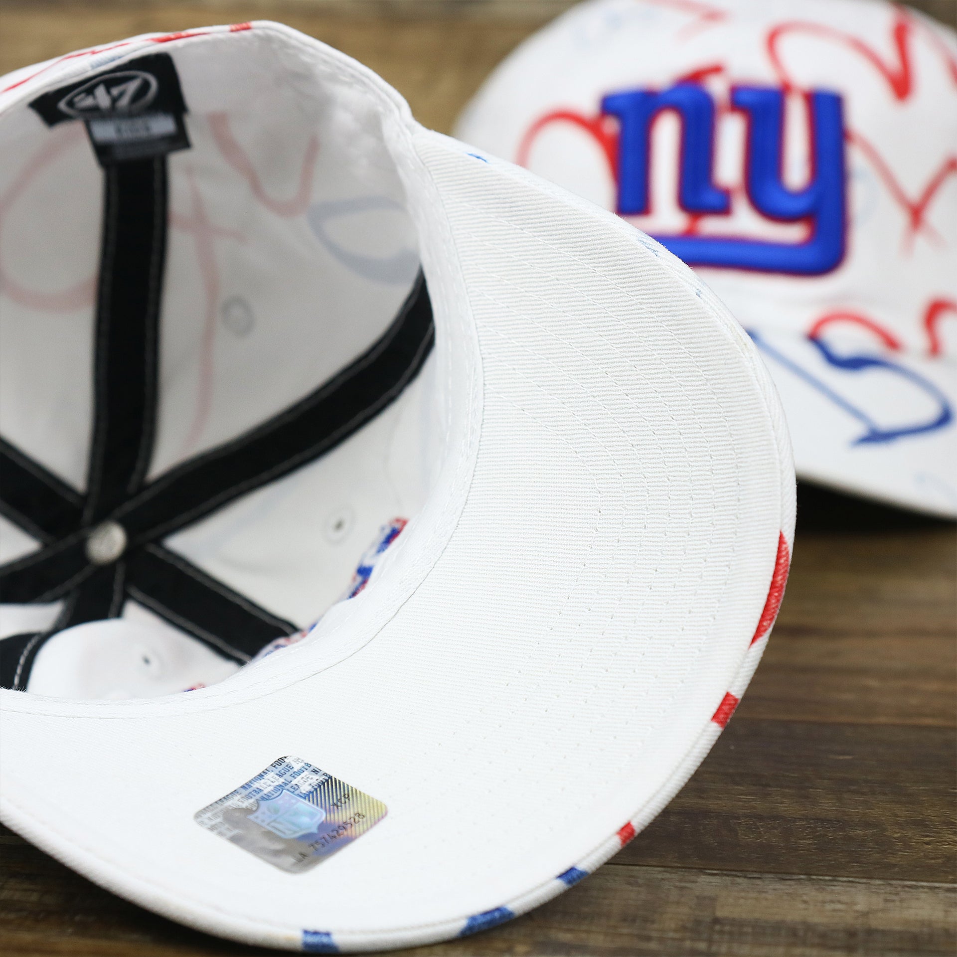 The undervisor on the Kids New York Giants Hearts All Over Print Dad Hat | White Kid’s Dad Hat