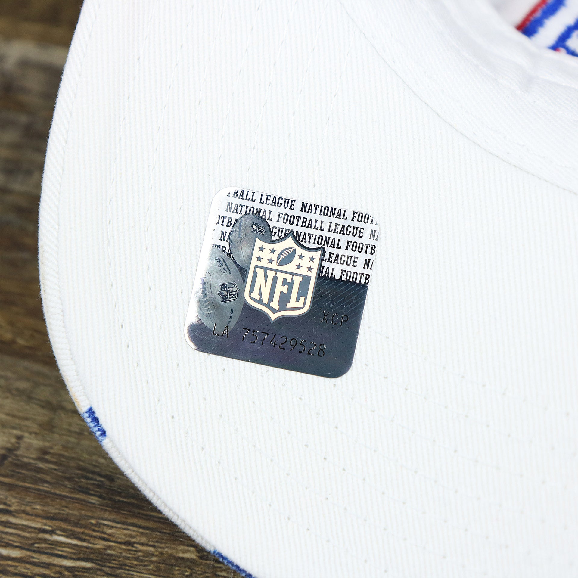 The NLF Sticker on the Kids New York Giants Hearts All Over Print Dad Hat | White Kid’s Dad Hat
