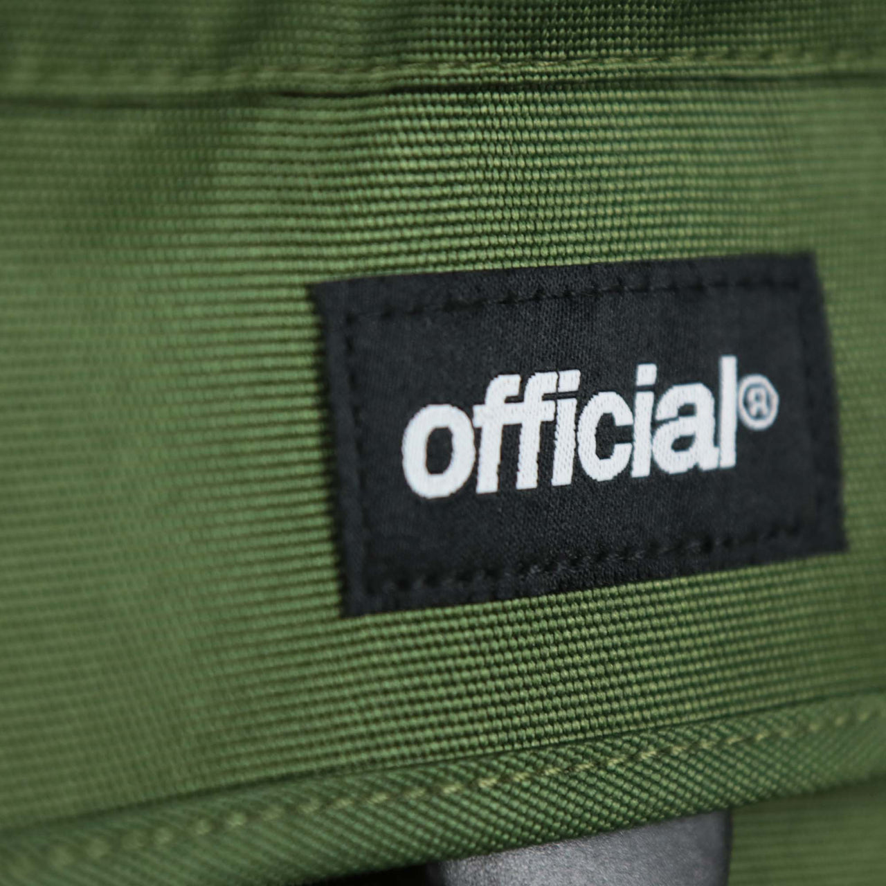 The official tag on the Essential Nylon Shoulder Bag Streetwear with Mesh Pocket | Official Olive