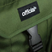 The clasp and tag on the Essential Nylon Shoulder Bag Streetwear with Mesh Pocket | Official Olive