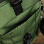 The front pocket on the Essential Nylon Shoulder Bag Streetwear with Mesh Pocket | Official Olive