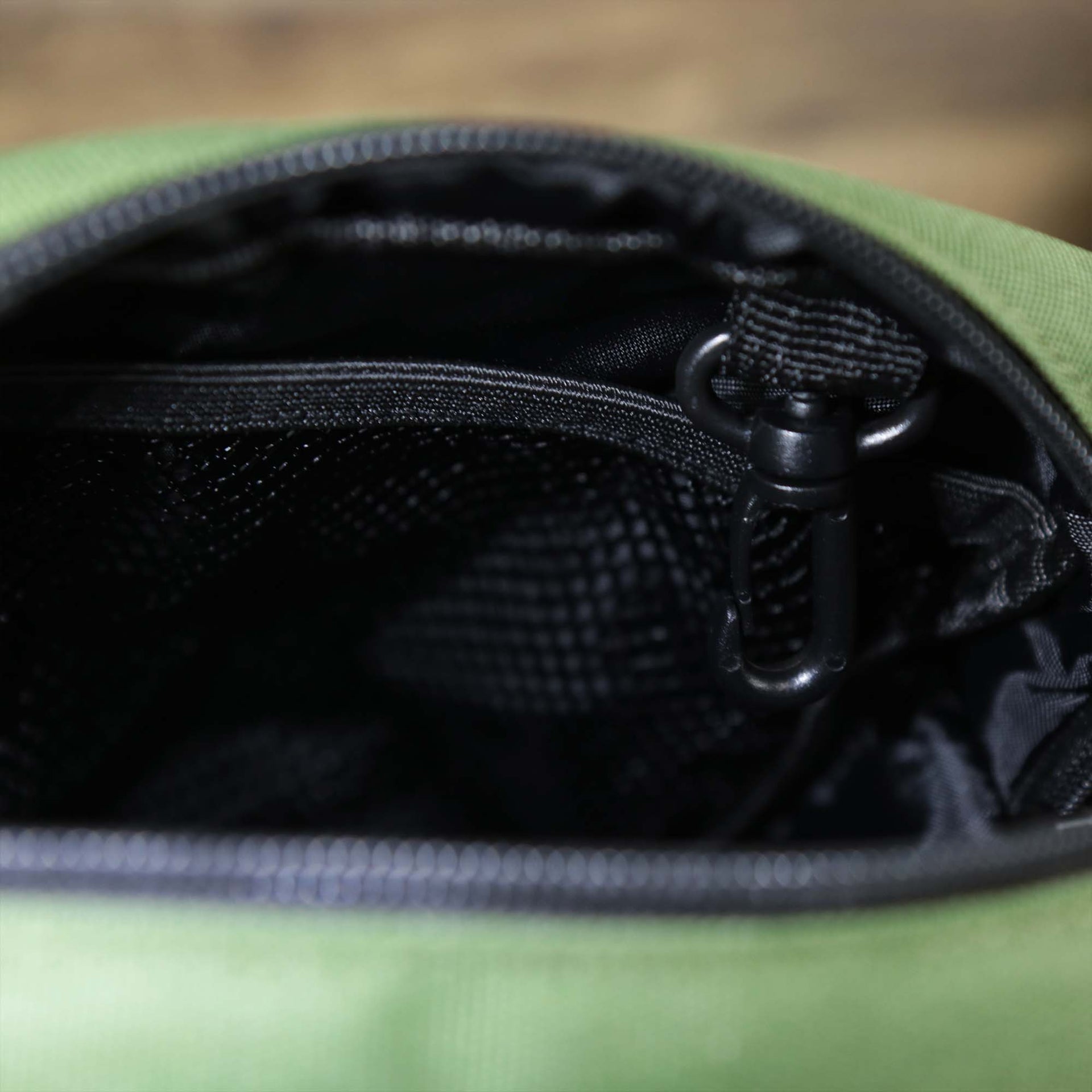 The main pocket on the Essential Nylon Shoulder Bag Streetwear with Mesh Pocket | Official Olive
