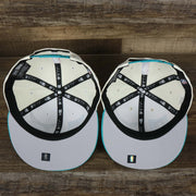 The underside of the Charlotte Hornets NBA 2022 Draft Gray Bottom 9Fifty Snapback | New Era Cream/Turquoise with the Youth Version