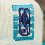 The NBA Jerry West Logo overtop CHA on the Charlotte Hornets NBA 2022 Draft Gray Bottom 9Fifty Snapback | New Era Cream/Turquoise