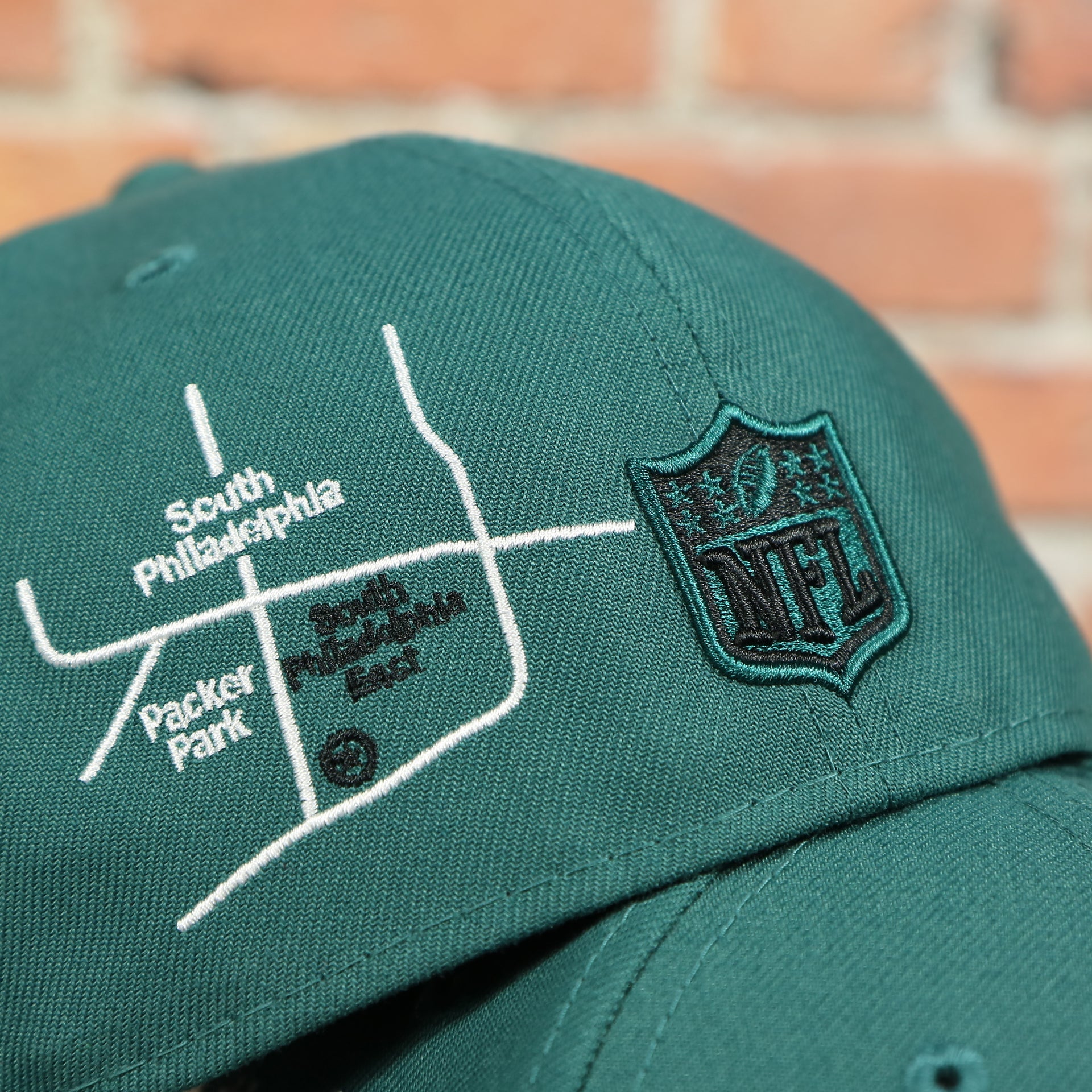 South Philadelphia East and NFL logo on the Philadelphia Eagles City Transit All Over Side Patch Gray Bottom 59Fifty Fitted Cap