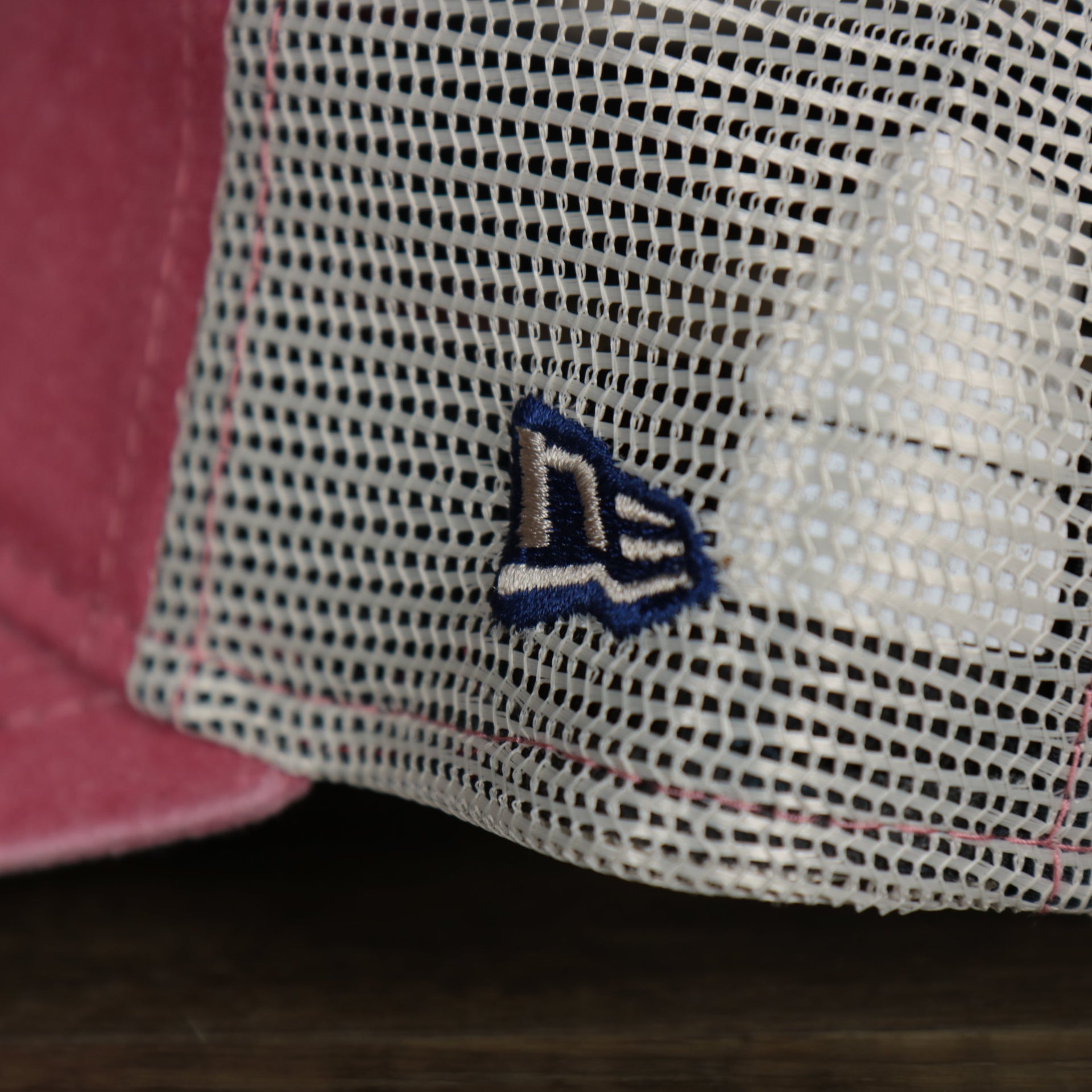 A close up of the New Era logo on the Philadelphia Phillies New Era 9Twenty Washed Trucker Youth hat
