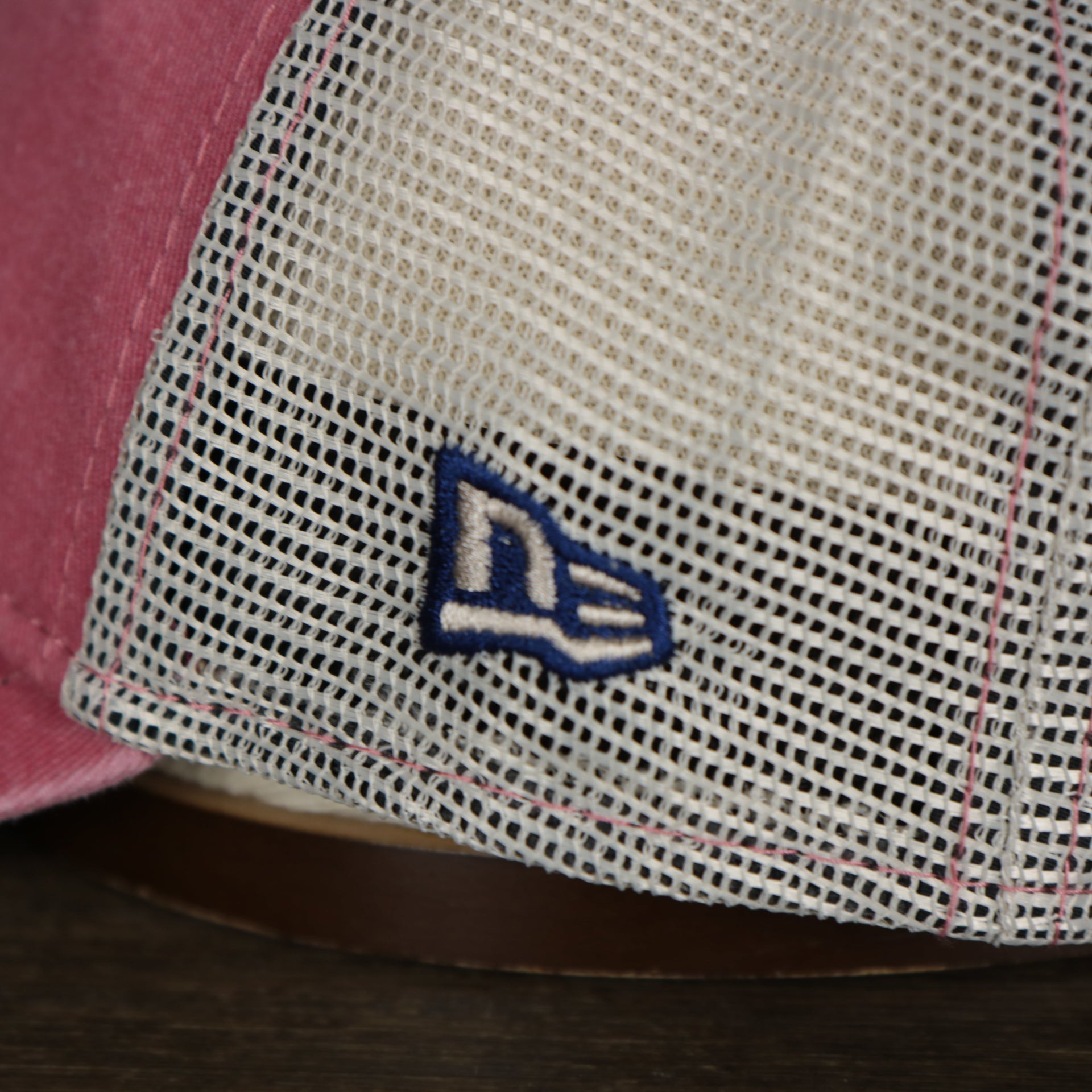A close up of the New Era logo on the Philadelphia Phillies New Era 9Twenty Washed Trucker hat