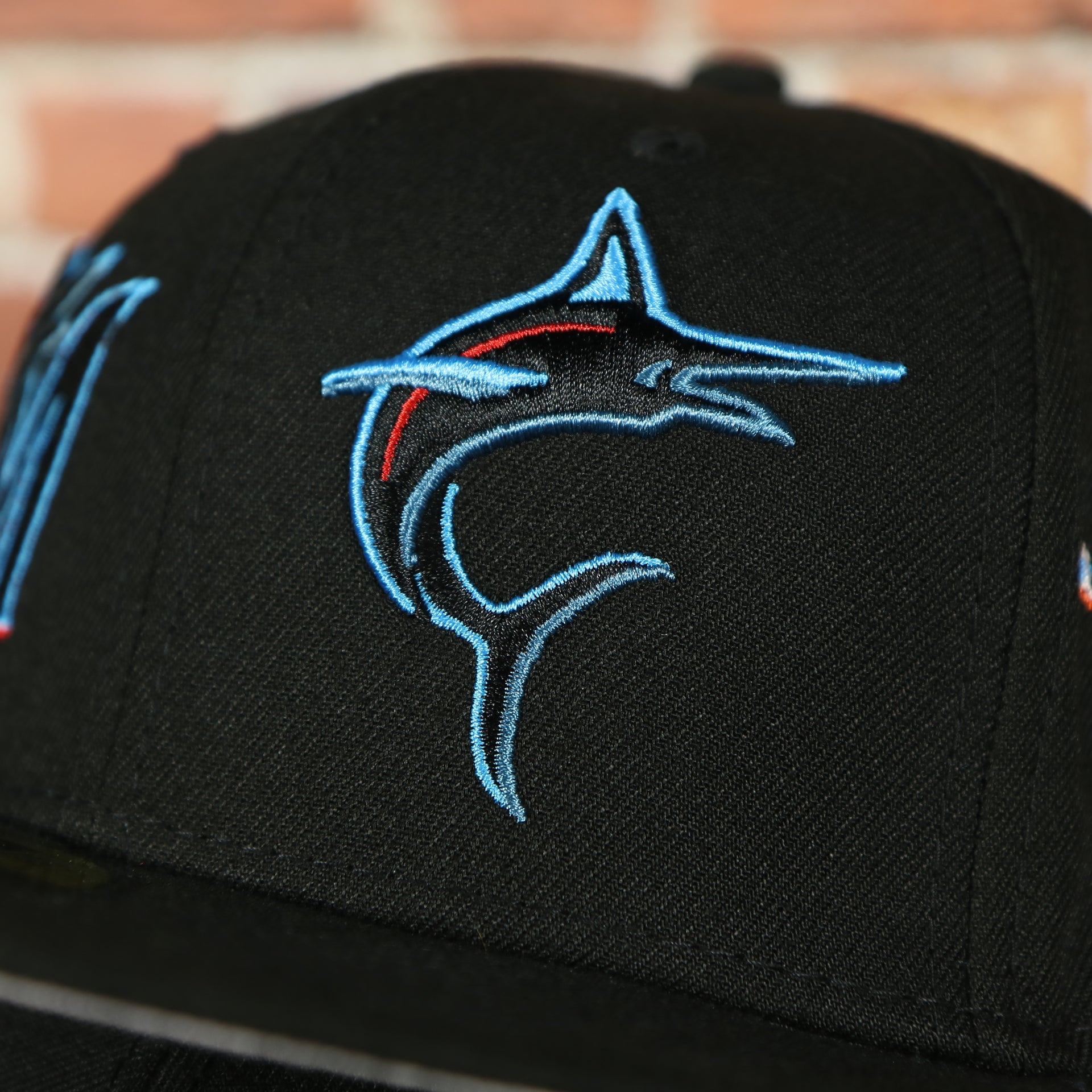 marlins logo on the Miami Marlins "Patch Pride" All Over Gray Bottom Side Patch 59Fifty Fitted Cap