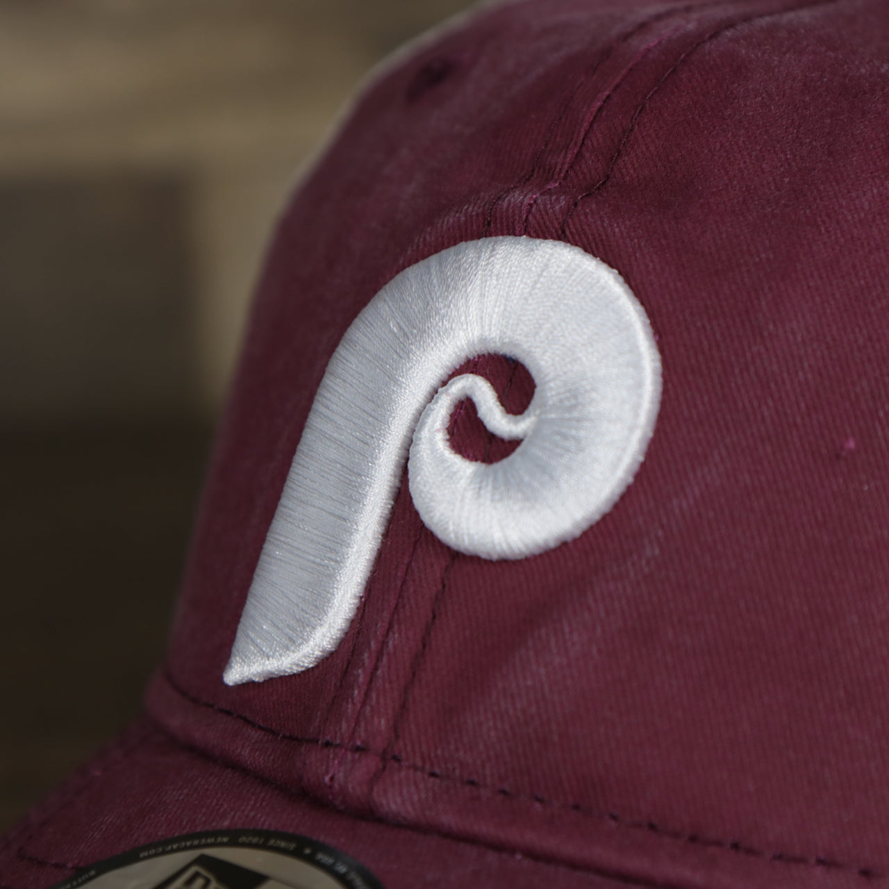 A close up of the Phillies Cooperstown logo on the Philadelphia Phillies Cooperstown New Era 9Twenty Washed Trucker Youth hat