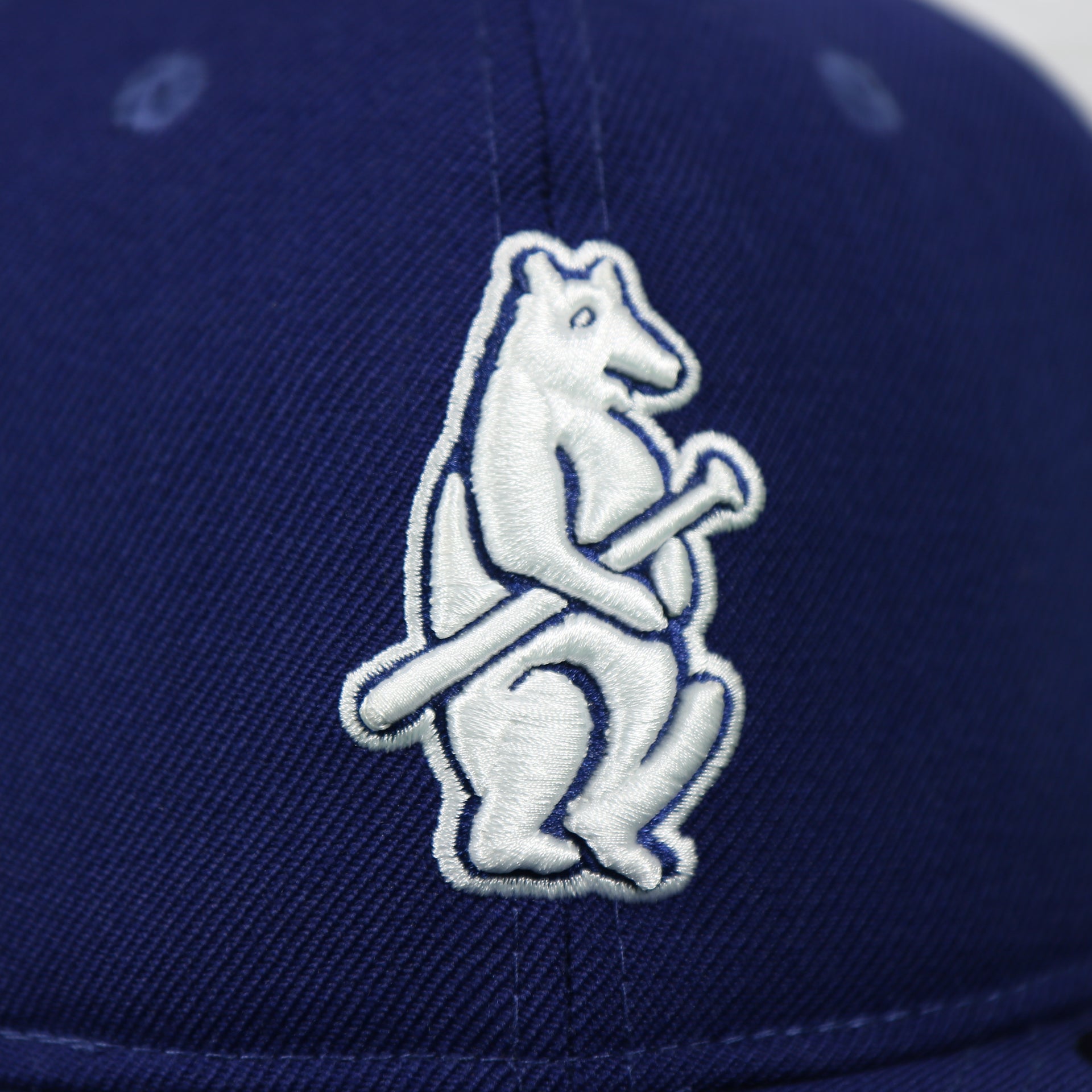 logo on the front of the Chicago Cubs Cooperstown Blue 59FIFTY Green Bottom Fitted Cap | Blue