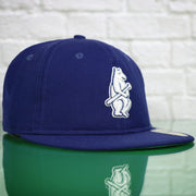 front of the Chicago Cubs Cooperstown Blue 59FIFTY Green Bottom Fitted Cap | Blue