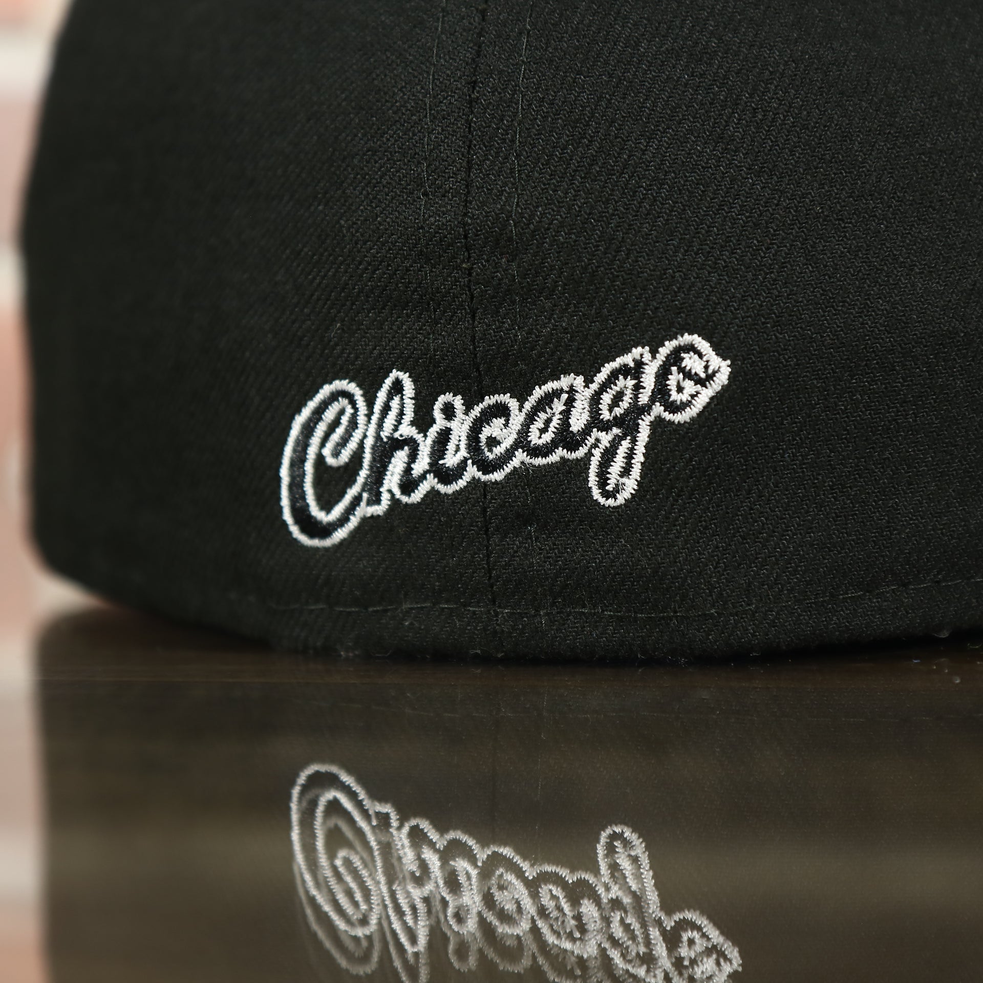 Chicago bulls script font on the back of the Chicago Bulls Black 59FIFTY Grey Bottom Fitted Cap | Black