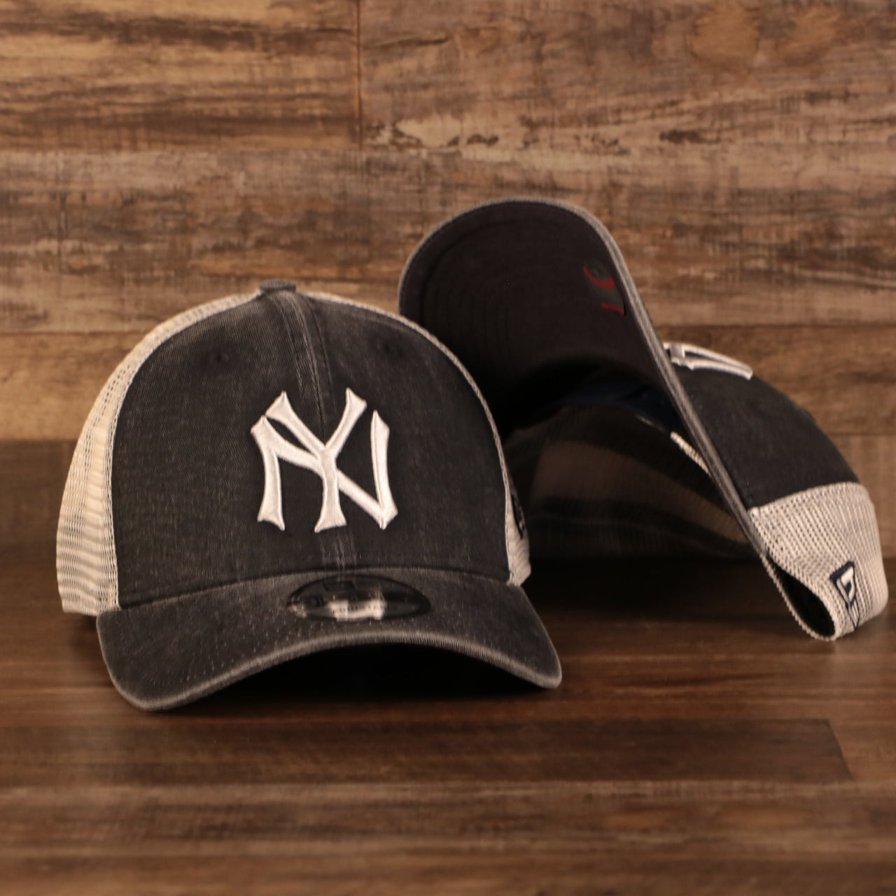 front and bottom of the New York Yankees Vintage Dark Gray Adjustable 9Forty Trucker Dad Hat