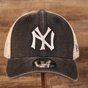 front of the New York Yankees Vintage Dark Gray Adjustable 9Forty Trucker Dad Hat