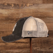 wearers left side of the New York Yankees Vintage Dark Gray Adjustable 9Forty Trucker Dad Hat