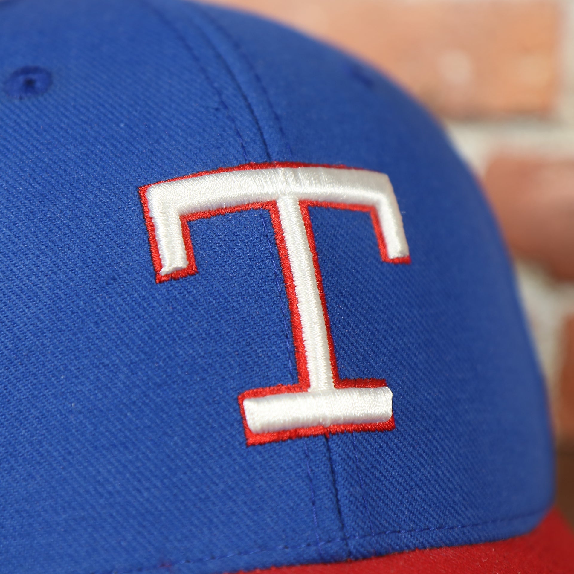 texas rangers logo on the front of the Texas Rangers American Needle Green Bottom Throwback Blue Wool Dad Hat | OSFM