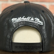 mitchell and ness logo on the Miami Heat Perforated Leather Snapback | Black Miami Heat Snap Back with Racing Leather