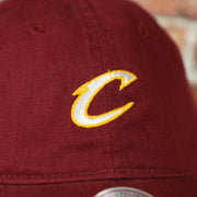 cavs logo on the front of the Cleveland Cavaliers Maroon Dad Hat | Maroon Mitchell and Ness Adjustable Baseball Cap