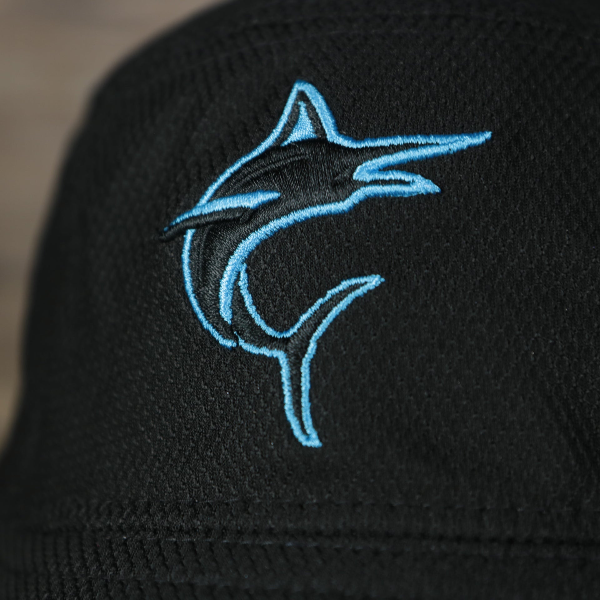 A close up of the Marlins logo on the Miami Marlins MLB 2022 Spring Training Onfield Bucket Hat