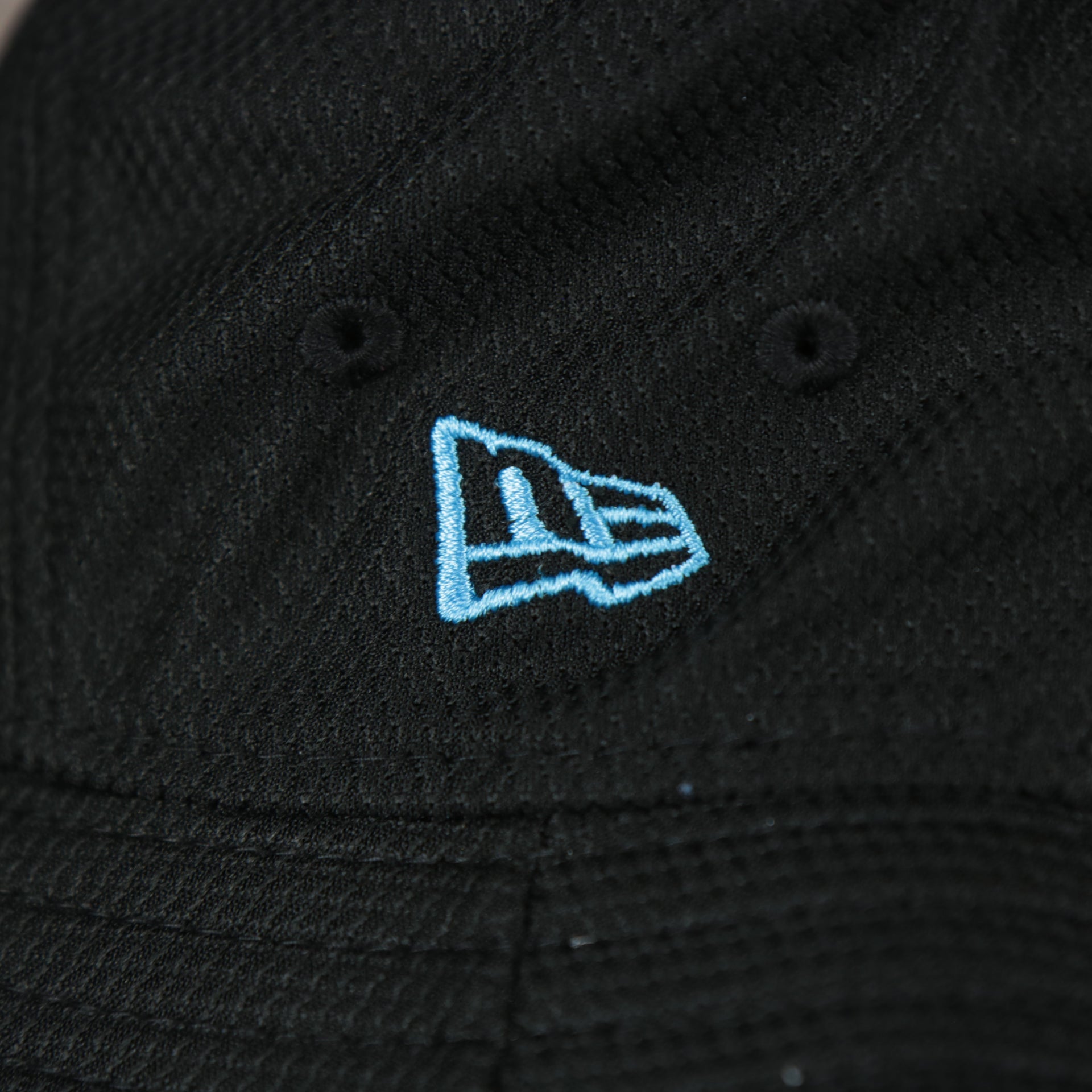 A close up of the New Era logo on the Miami Marlins MLB 2022 Spring Training Onfield Bucket Hat