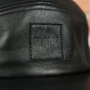 HUF logo on the Huf 100% Genuine Lambskin Leather Black Five Panel Strapback Hat
