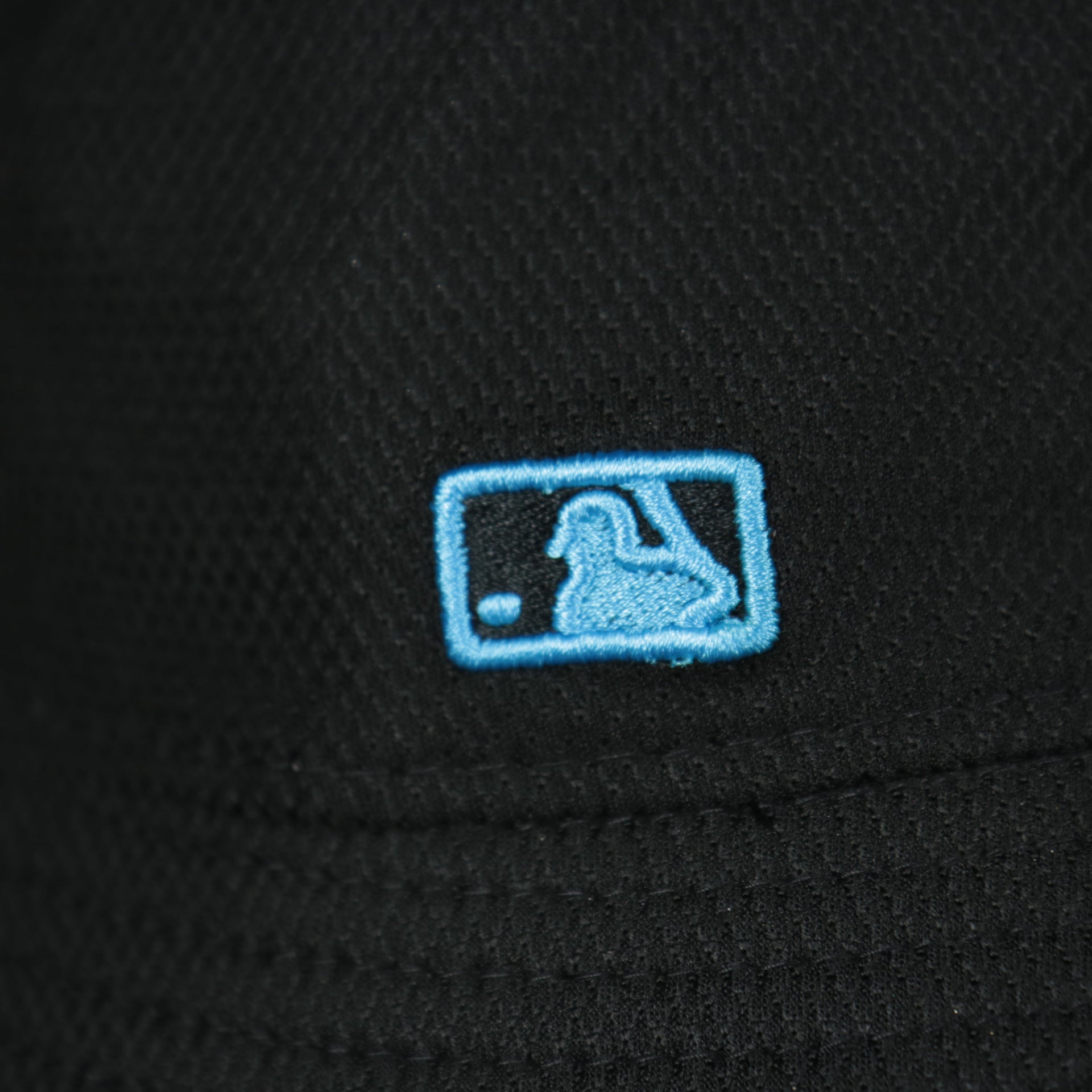 A close up of the MLB Batterman logo on the Miami Marlins MLB 2022 Spring Training Onfield Bucket Hat