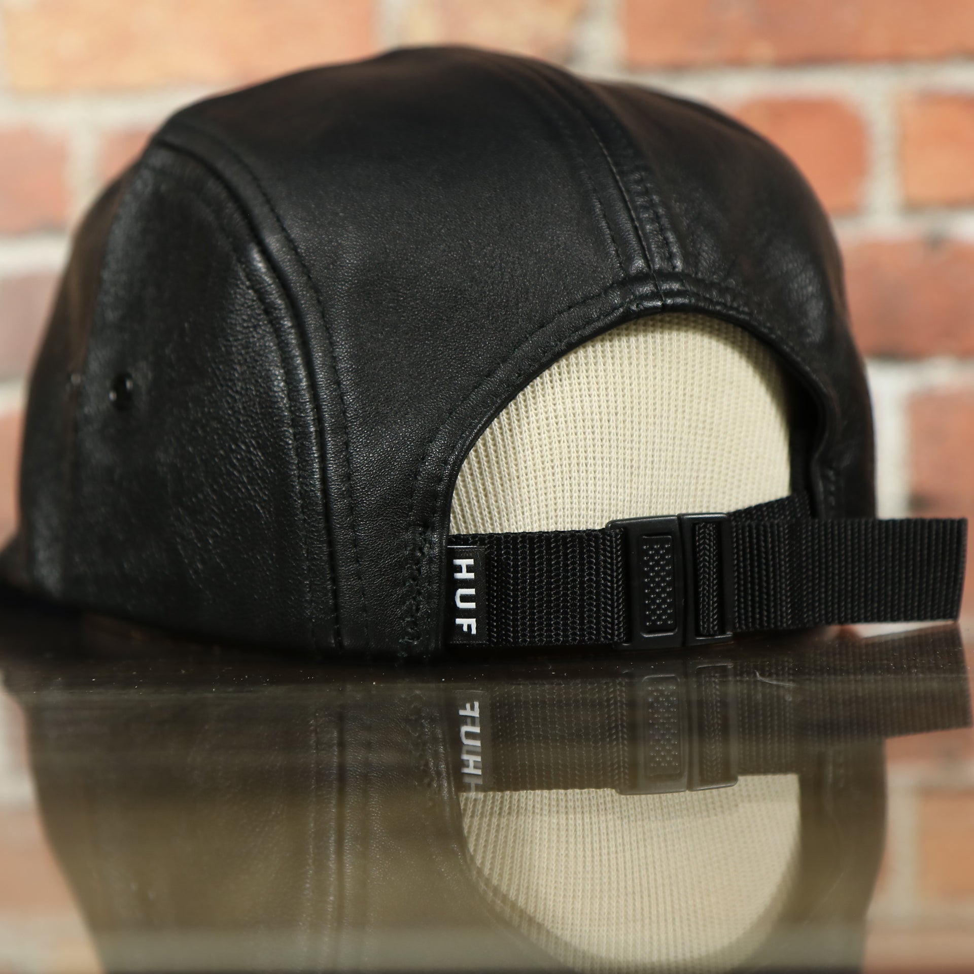 adjustable strap on the Huf 100% Genuine Lambskin Leather Black Five Panel Strapback Hat
