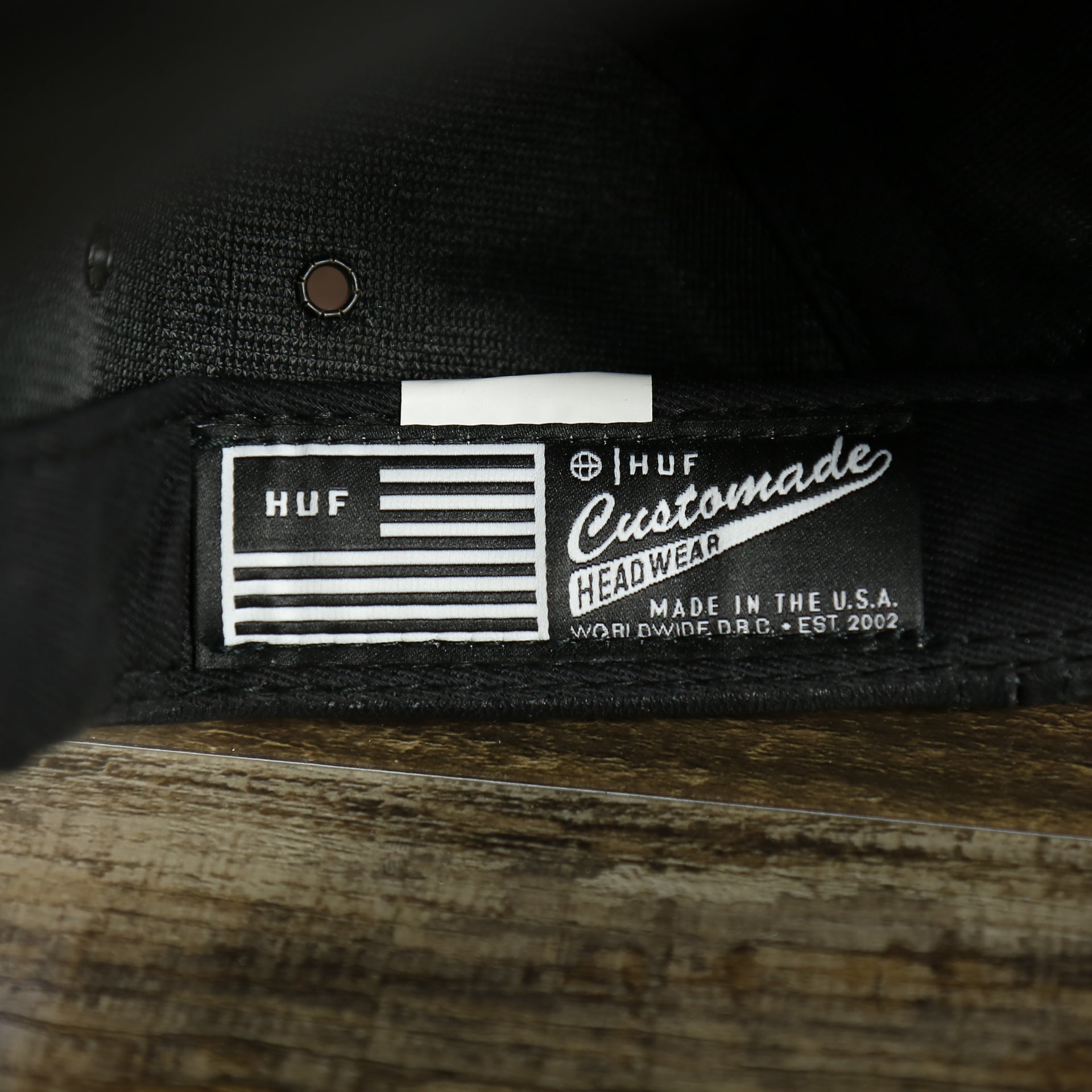 HUF label on the Huf 100% Genuine Lambskin Leather Black Five Panel Strapback Hat