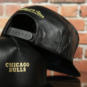black adjustable snap on the Chicago Bulls Leather Snapback | Black Bulls Snap Back with Gold Foil Design