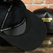 black under visor on the Chicago Bulls Leather Snapback | Black Bulls Snap Back with Gold Foil Design