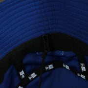 A close up of the removeable chin strap  on the New York Mets  MLB 2022 Spring Training Onfield Bucket Hat