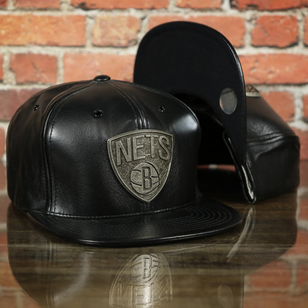 Brooklyn Nets 100% Genuine Lambskin Leather Mitchell and Ness Embossed Metalic Shield Snapback Hat