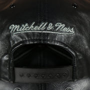 mitchell and ness logo on the Brooklyn Nets 100% Genuine Lambskin Leather Mitchell and Ness Embossed Metalic Shield Snapback Hat