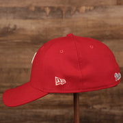 The white New Era patch on the left side of the Philadelphia Phillies red MLB on field fathers day 39thirty flexfit cap.