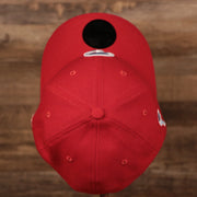 A top side view of the red Phillies 3930 flexfit New Era fathers day 2021 cap by New Era.