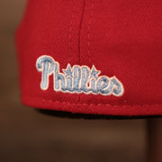 A close up of the light blue Phillies patch on the backside of the red Philadelphia Phillies MLB fathers day hats by New Era.