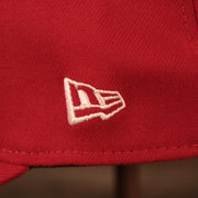 A close up of the white New Era patch on the left side of the Philadelphia Phillies red MLB on field fathers day 39thirty flexfit cap.