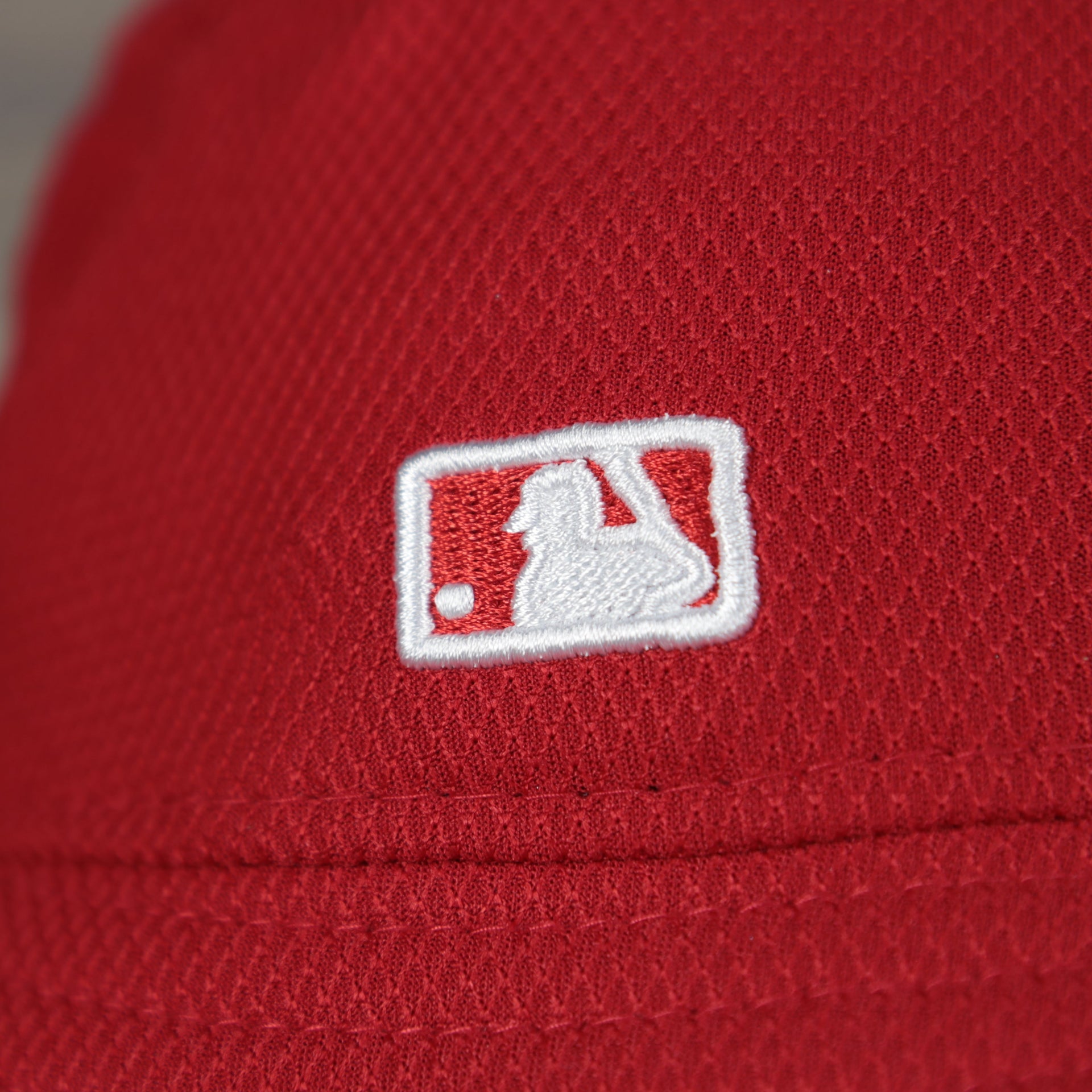 A close up of the MLB Batterman logo on the Philadelphia Phillies MLB 2022 Spring Training Onfield Bucket Hat