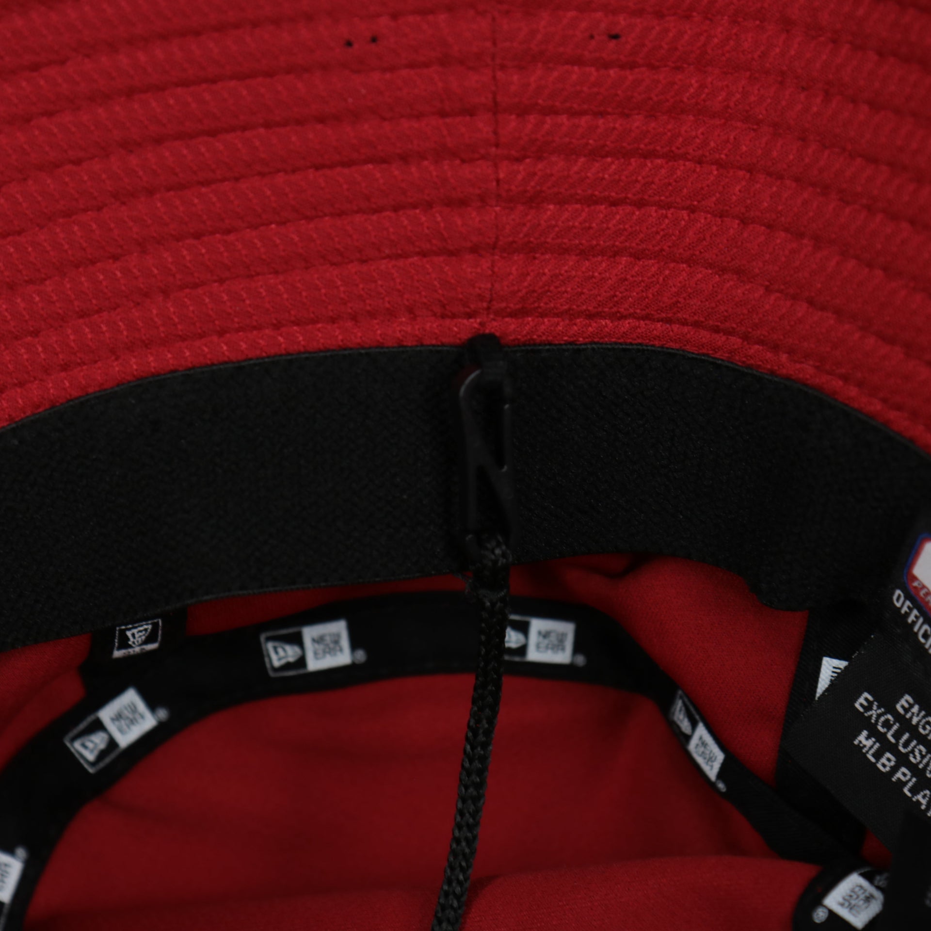 A close up of the removable chin strap on the Philadelphia Phillies MLB 2022 Spring Training Onfield Bucket Hat